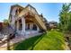 Landscaped backyard with patio, fire pit and lush lawn, perfect for outdoor living at 10221 Nucla St, Commerce City, CO 80022