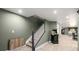 Finished basement area with stairs, pool table, and an arcade game at 10221 Nucla St, Commerce City, CO 80022