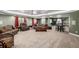Finished basement with seating area, projector, bar seating, and entertainment options at 10221 Nucla St, Commerce City, CO 80022