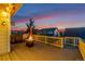 Relaxing deck with a fire pit, offering an outdoor retreat with a view of the surrounding neighborhood at 10221 Nucla St, Commerce City, CO 80022