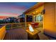 Exterior view of deck with string lights and fire pit, perfect for outdoor entertaining and creating a cozy ambiance at 10221 Nucla St, Commerce City, CO 80022