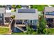 Aerial view of the home with solar panels, backyard deck, trampoline, and manicured landscaping at 10221 Nucla St, Commerce City, CO 80022