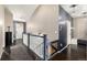 Hallway featuring dark hardwood floors, neutral walls with white accents and a carpet runner at 10221 Nucla St, Commerce City, CO 80022