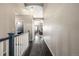 Hallway with arched ceilings, neutral paint and a long runner, offering a glimpse into the living spaces at 10221 Nucla St, Commerce City, CO 80022