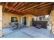 Covered back patio, sitting area, hot tub, and plenty of room for entertainment at 10221 Nucla St, Commerce City, CO 80022