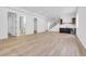 Spacious basement with light wood floors, a bar area, and ample room for entertaining at 1491 S York St, Denver, CO 80210