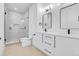 Contemporary bathroom with a glass-enclosed shower, dual vanities, and modern fixtures at 1491 S York St, Denver, CO 80210