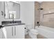 Modern bathroom with a sleek vanity, integrated sink, and a walk-in shower featuring upscale tile at 1491 S York St, Denver, CO 80210