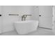 Sleek bathroom with a freestanding tub, modern fixtures, and minimalist design at 1491 S York St, Denver, CO 80210