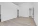 Modern bedroom with light wood floors and multiple doorways offers a flexible layout at 1491 S York St, Denver, CO 80210
