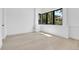 Bright, airy bedroom with large windows and light hardwood floors, creating a serene space at 1491 S York St, Denver, CO 80210