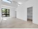 Minimalist bedroom with sleek wood floors, modern windows and walk-in closet provides a bright, spacious feel at 1491 S York St, Denver, CO 80210