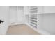 Well-organized walk-in closet with built-in shelving and drawers for storage at 1491 S York St, Denver, CO 80210