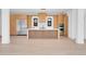 Modern kitchen with sleek wood cabinets, a large island, stainless steel appliances, and light hardwood floors at 1491 S York St, Denver, CO 80210