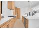 Spacious modern kitchen boasts stainless appliances, wood cabinetry, expansive countertops and design at 1491 S York St, Denver, CO 80210