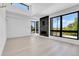 Bright living room with sleek wood floors, a modern fireplace and large windows, providing stylish and sunlit space at 1491 S York St, Denver, CO 80210
