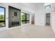 Bright living room featuring sleek wood floors, modern fireplace and an ensuite bathroom that provides a stylish entertainment space at 1491 S York St, Denver, CO 80210