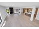 Expansive open-concept living area with hardwood floors, fireplace and seamlessly connected to the kitchen at 1491 S York St, Denver, CO 80210