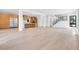 Bright open-concept layout featuring hardwood floors, a modern kitchen and a staircase at 1491 S York St, Denver, CO 80210