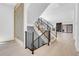Bright open floor plan with modern staircase and black iron railings leading to the upper level at 1491 S York St, Denver, CO 80210