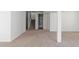Spacious finished basement area with neutral carpet, staircase, and adjacent bathroom at 20550 E Lake Cir, Centennial, CO 80016