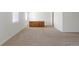 Carpeted bonus room in basement features natural light and offers ample storage at 20550 E Lake Cir, Centennial, CO 80016
