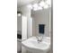 Clean, bright bathroom with modern fixtures, a large sink, and a storage cabinet at 20550 E Lake Cir, Centennial, CO 80016