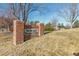 Brick sign for the 'Swim and Tennis Club' within the community at 20550 E Lake Cir, Centennial, CO 80016