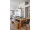 Open dining area with a rustic wooden table, stylish chairs, and natural light at 20550 E Lake Cir, Centennial, CO 80016