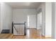 Bright foyer with hardwood floors and an arched doorway leading to other rooms at 20550 E Lake Cir, Centennial, CO 80016