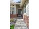 A pathway leads up to the front door with brick accents and decorative columns at 20550 E Lake Cir, Centennial, CO 80016