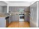 Modern kitchen with stainless steel appliances, granite countertops, and ample cabinet space at 20550 E Lake Cir, Centennial, CO 80016