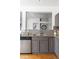 A modern kitchen with granite countertops, stainless steel appliances, and a mosaic tile backsplash at 20550 E Lake Cir, Centennial, CO 80016