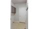 Functional laundry room with overhead cabinets and ample floor space at 20550 E Lake Cir, Centennial, CO 80016