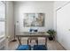 Cozy office space with neutral colors, a comfortable chair, and ample lighting at 20550 E Lake Cir, Centennial, CO 80016