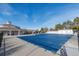 Large community pool with a covered area, a slide, and landscaping at 20550 E Lake Cir, Centennial, CO 80016