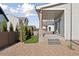 Backyard features a covered patio with wooden columns and a well-maintained yard surrounded by a fence at 1426 Swan Peter Dr, Berthoud, CO 80513