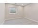 Finished basement room with natural light, carpet flooring, and ample space for various uses at 1426 Swan Peter Dr, Berthoud, CO 80513