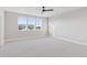 Spacious bedroom with large windows providing ample natural light and plush carpeting at 1426 Swan Peter Dr, Berthoud, CO 80513