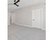 Large bedroom featuring plush carpeting, two closets, and two entry doors at 1426 Swan Peter Dr, Berthoud, CO 80513