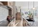 Modern kitchen featuring stainless steel appliances, stylish cabinetry, and a view of the staircase at 1426 Swan Peter Dr, Berthoud, CO 80513