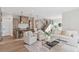 Open-concept living space with a modern kitchen, comfortable seating, and stylish decor at 1426 Swan Peter Dr, Berthoud, CO 80513