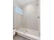 Modern shower with glass enclosure and decorative tile at 1426 Swan Peter Dr, Berthoud, CO 80513