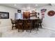 Basement bar with granite countertop and wooden cabinetry at 24237 E Glasgow Cir, Aurora, CO 80016