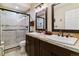 Basement bathroom with double vanity and walk-in shower at 24237 E Glasgow Cir, Aurora, CO 80016