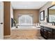 Relaxing bathroom with soaking tub and built-in fireplace at 24237 E Glasgow Cir, Aurora, CO 80016