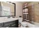 Well-lit bathroom with shower/tub combo and updated vanity at 24237 E Glasgow Cir, Aurora, CO 80016