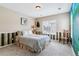 Cozy bedroom with a rustic wooden bed frame and charming decor at 24237 E Glasgow Cir, Aurora, CO 80016