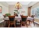 Elegant dining room with hardwood floors and a chandelier at 24237 E Glasgow Cir, Aurora, CO 80016