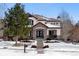 Two-story house with stone accents and a landscaped yard at 24237 E Glasgow Cir, Aurora, CO 80016